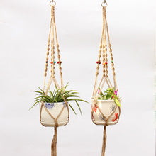Load image into Gallery viewer, Hanging net on wall of flower pot